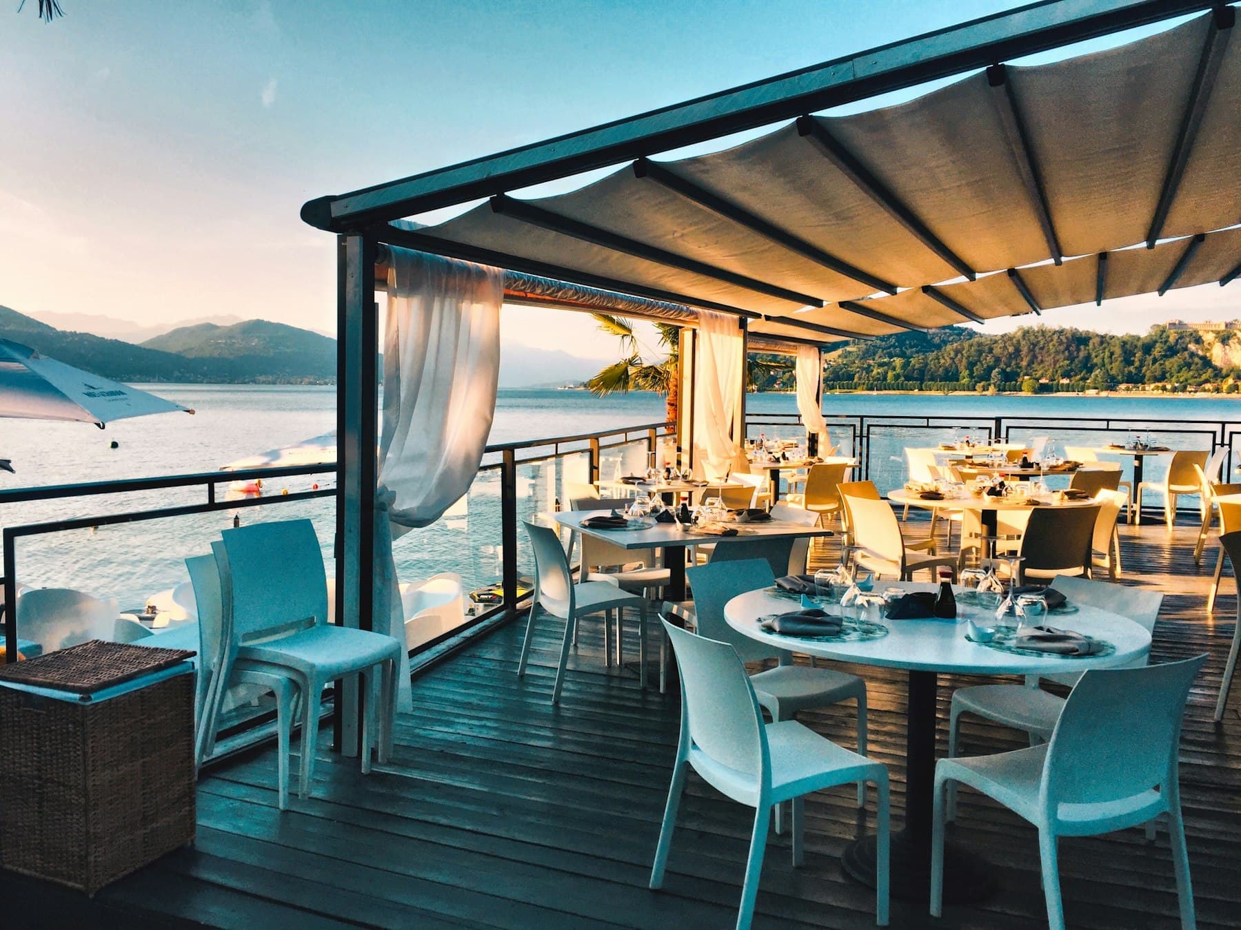 Outdoor terrace with tables arranged for an open-air event